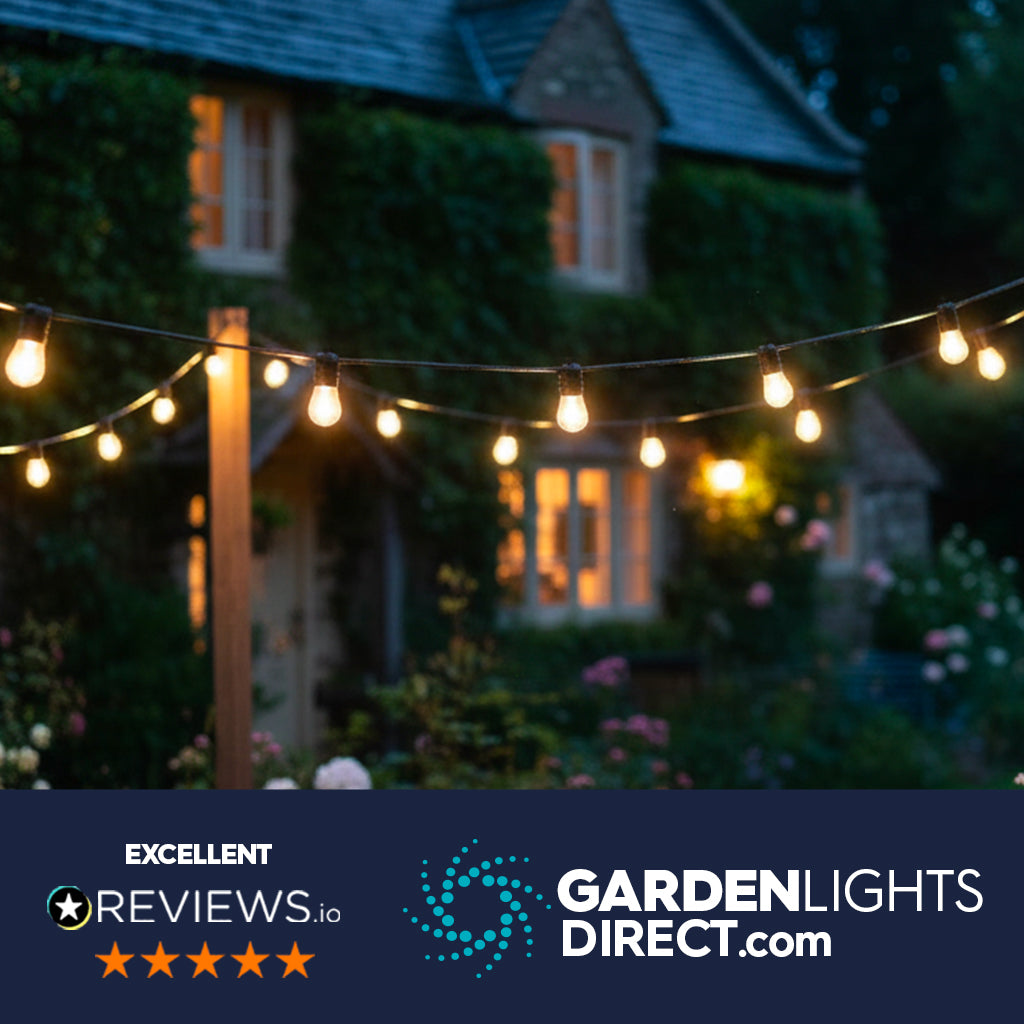 String lights in a garden with a house in the background, featuring Garden Lights Direct branding.