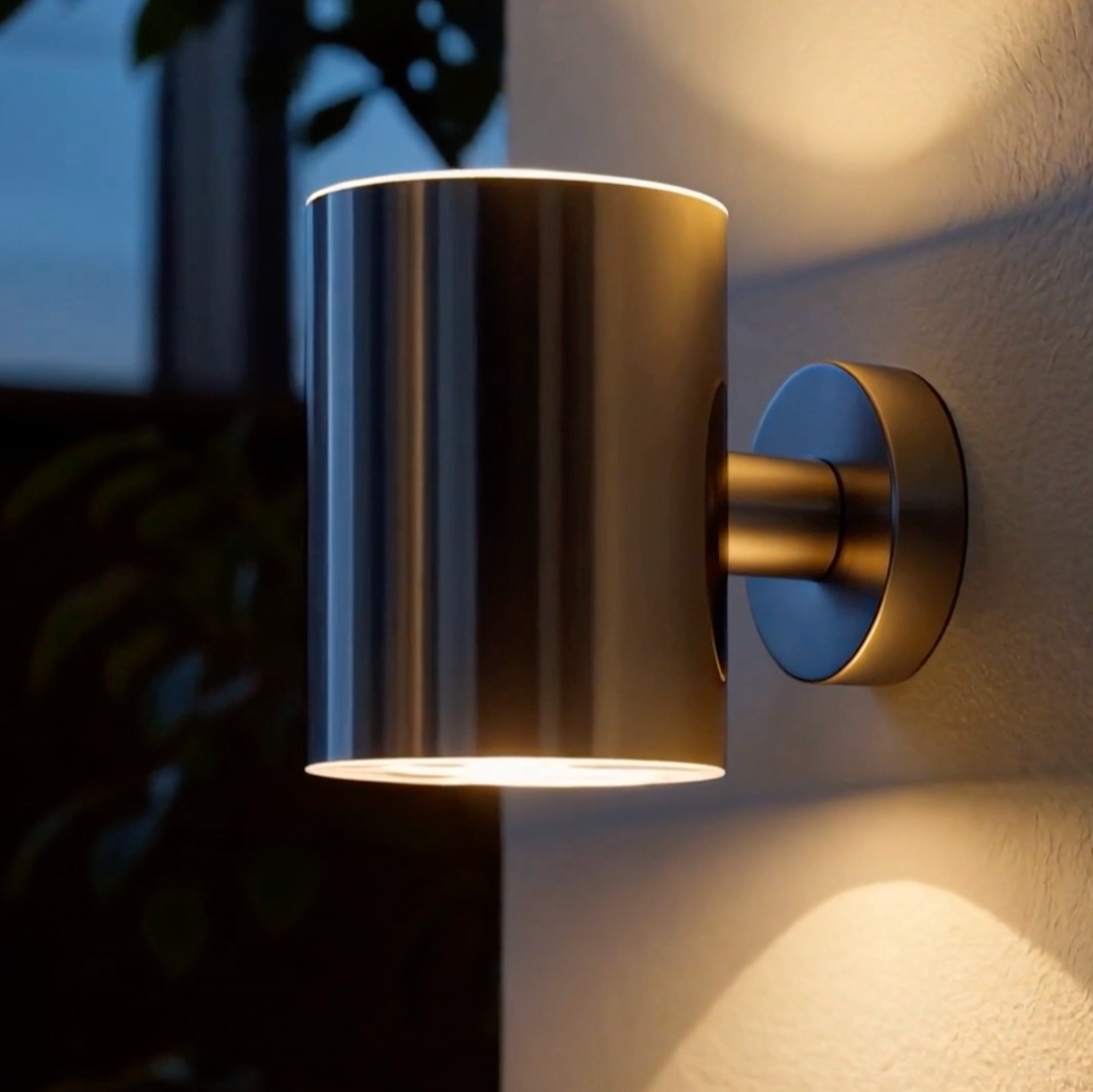 Modern wall-mounted light fixture on a textured wall